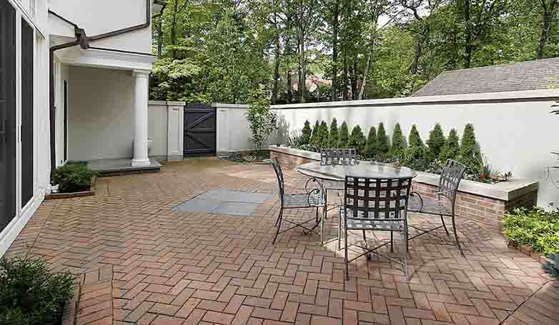 This is a perfect space for intimate space to loosen up and enjoy a warm evening in the backyard -Transitional Backyard Brick Pavers