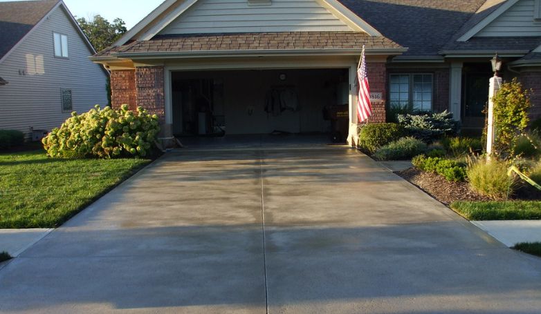 A concrete driveway with newly applied Film-foaming sealer