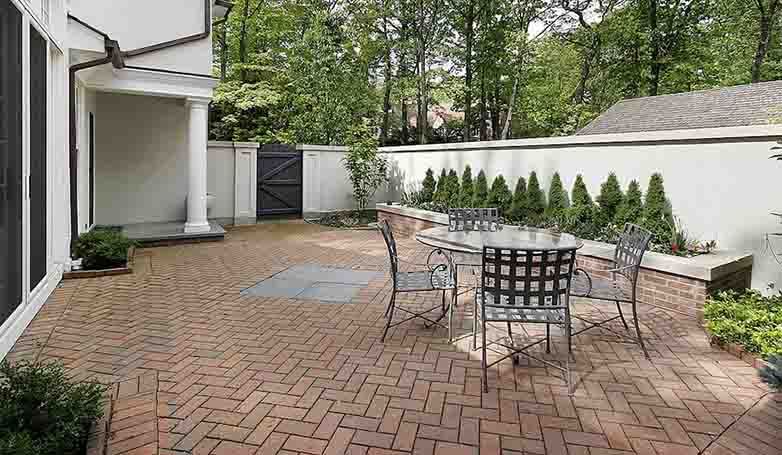 A relaxing ambiance of brick patio at the back of the house.