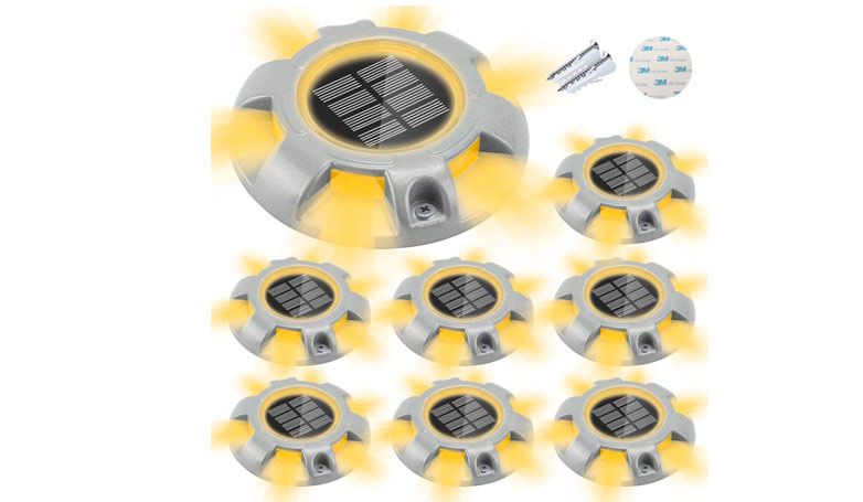 Solar lights with a circle design and yellow lights that add visibility on the driveway.