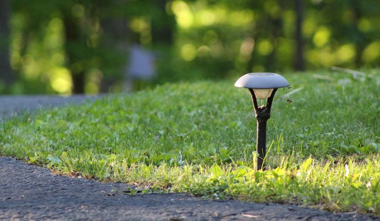 An old solar driveway light was installed on the grass