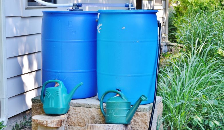 Rain barrels used to collect water, an excellent drainage system for the patio
