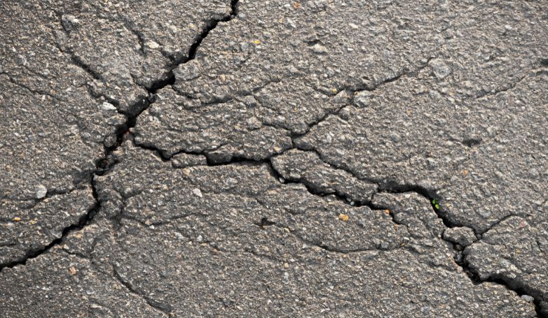 Some cracks in the asphalt were repaired before the winter months arrived