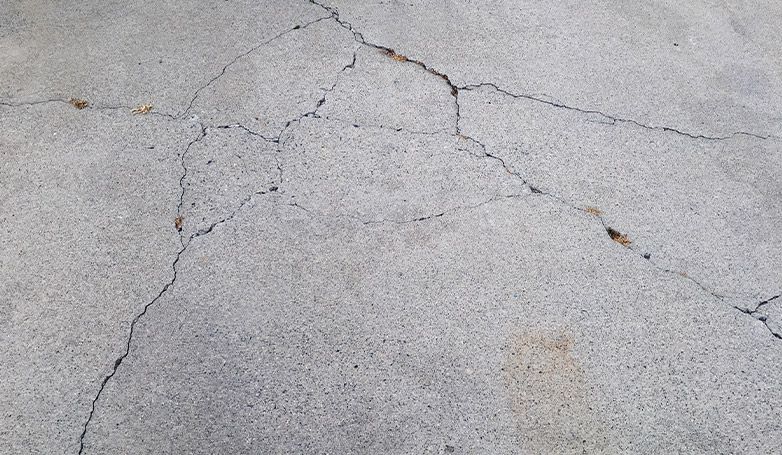 An example of a concrete parking lot with cracks