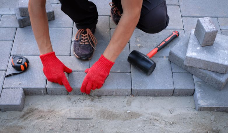 The worker answers frequently asked questions about cheap patio pavers ideas