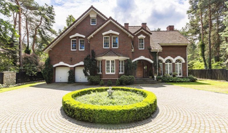 An elegant house with bricks circular driveway