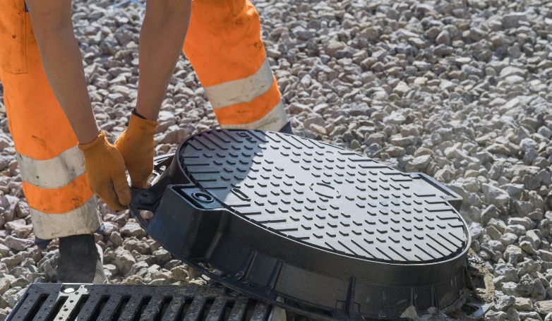 The worker answers the most frequently asked questions regarding storm drain repair