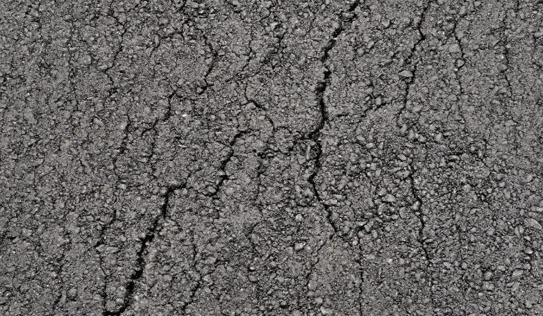 Cracks on the tar and chip driveway