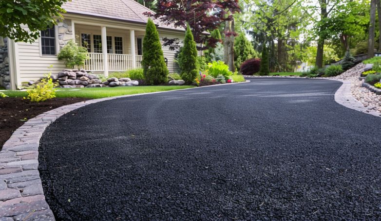 An asphalt driveway with some decorative finishes